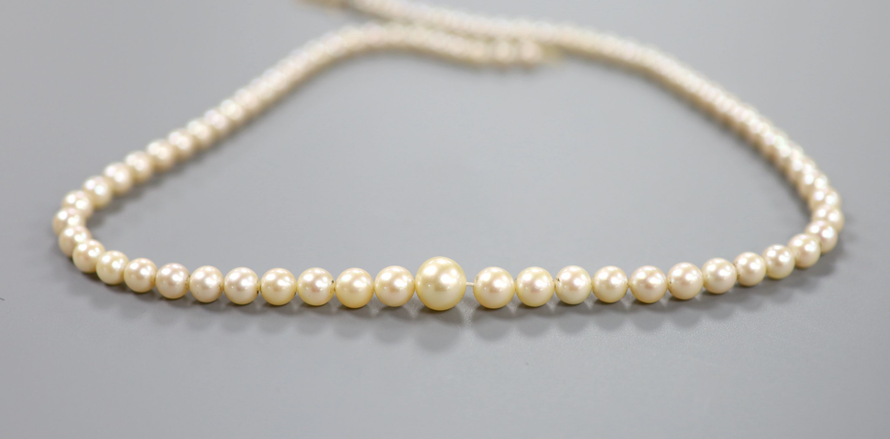 A single strand graduated cultured pearl necklace, with part of a 9ct gold clasp, 43cm.